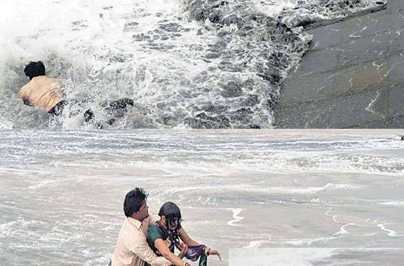 Love in time of Cyclone Hudhud: Love in Breathtaking pics of man rescuing his wife