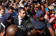 Olympic and Paralympic sprinter Oscar Pistorius started his five-year jail sentence on Tuesday for killing his girlfriend Reeva Steenkamp, marking the end of a trial that has gripped South Africa and millions around the world. His uncle, Arnold Pistorius, indicated he would not appeal.  As judge Thokozile Masipa gave her decision on the 27-year-old’s culpable homicide conviction, Pistorius, whose downfall has been likened to that of American football star O.J. Simpson, stood resolutely in the dock. His only reaction was to wipe his eyes before two police officers led him to the holding cells beneath the High Court in the heart of the South African capital. Ninety minutes later, an armored police vehicle carrying Pistorius – still dressed in dark suit, white shirt and black tie – left the building through a throng of reporters toward Pretoria Central Prison, where he is expected to serve his time. Once the execution site for opponents of South Africa’s former white-minority government, the jail is now home to the country’s most hardened criminals, including the man known as “Prime Evil”, apartheid death squad leader Eugene de Kock. Prisons officials said Pistorius, whose lower legs were amputated when he was a baby, would be housed in a separate and secure hospital wing of the massive complex. “ONE LAW FOR ALL” In delivering her decision, 67-year-old Masipa stressed the difficulty of arriving at a decision that was “fair and just to society and to the accused”. She also rebuffed suggestions that Pistorius – a wealthy and influential white man – might be able to secure preferential justice despite the “equality before law” guarantee enshrined in the post-apartheid 1996 constitution. “It would be a sad day for this country if an impression were created that there is one law for the poor and disadvantaged, and one law for the rich and famous,” she said. Steenkamp, a 29-year-old law graduate and model, died almost instantly on Valentine’s Day last year when Pistorius shot her through a locked toilet door at his luxury Pretoria home. Prosecutors pushed for a murder conviction, but the athlete maintained he fired in the mistaken belief an intruder was hiding behind the door, a defense that struck home in a country with one of the world’s highest rates of violent crime. The ruling African National Congress’ Women’s League, which is at the forefront of political efforts to tackle violence against South African women, on Tuesday called for an appeal by the state against the Sept. 12 culpable homicide conviction. But Steenkamp’s family said it was satisfied with the sentence. “Justice was served,” family lawyer Dup De Bruyn told reporters outside the court. The judge had given “the right sentence”, he said. “DARK AGES” GONE With no minimum sentence for culpable homicide, South Africa’s equivalent of manslaughter, Pistorius could have been punished with a few years of house arrest combined with community service. Before the decision, protesters picketed outside the court, a sign of the anger that might have ensued and the damage that might have been done to an often-criticized judicial system if the sentence were seen as too light. “Why are certain offenders more equal than others before the law?” said protester Golden Miles Bhudu, dressed in orange prison garb and wrapped in chains as he ridiculed Pistorius’ retching and crying during the seven-month trial, the first in South Africa to be broadcast live throughout. “He screams like a girl, he cries like a baby but he shoots like a soldier,” Bhudu said. However, Masipa pointed to the moral and philosophical changes South Africa has undergone since the end of white rule and the 1994 election of Nelson Mandela, saying the courts were no longer about mob justice and an “eye-for-an-eye”. “As a country we have moved on from the dark ages,” she said. “Society cannot always get what they want because courts do not exist to win popularity contests.” Many ordinary South Africans were unimpressed, especially after Pistorius’ defense lawyer, Barry Roux, said he expected the athlete to serve only 10 months of the five-year sentence behind bars, and the remainder under house arrest. “They are only scaring him with this sentence. It shows our society hasn’t transformed,” said Johannes Mbatha, a 38-year-old minibus taxi driver waiting at a Johannesburg bus station. “If it was a black man he would have never received such a light sentence. But that’s how things are in South Africa.” In Steenkamp’s home town of Port Elizabeth, a handful of family friends at a bar owned by her parents raised their hands in recognition of the five-year sentence. “I thought he would walk,” said 50-year-old Martin Cohen, who worked as a race horse trainer with Steenkamp’s father, Barry, who suffered a stroke shortly after his daughter’s killing.  The state prosecuting authority, which has two weeks to decide whether to launch an appeal against the verdict, said Pistorius was likely to serve at least a third of his sentence in prison or 20 months. On a separate conviction for firing a handgun in a packed Johannesburg restaurant, Pistorius was given a three-year suspended sentence. Even if he is freed early, Pistorius will not be able to resume his athletics career until his full term is served, the International Paralympic Committee said, ruling out any appearance at the 2016 Rio Olympics. Known as “Blade Runner” because of his carbon-fibre prosthetics, Pistorius became one of the biggest names in world athletics at the London 2012 Olympics when he reached the semi-finals of the 400m race against able-bodied athletes.