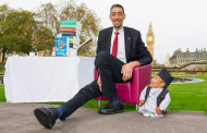 The VERY odd couple: Shortest man ever (21.5ins) meets tallest living person (8ft 1in) outside the Houses of Parliament for Guinness World Record Day