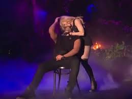 Drake gets kissed by Madonna, screws up his face in apparent discomfort