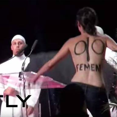 Topless feminists take over Islamist hardline conference on wife-beating in France