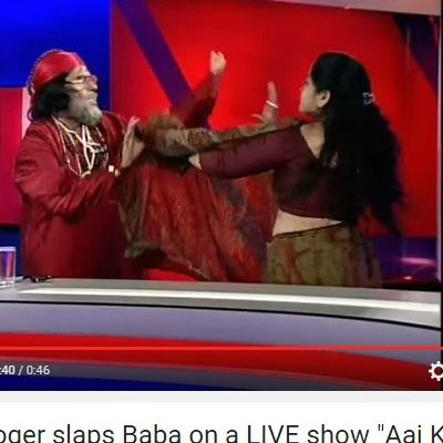 Swami omji slaps woman astrologer live on T.V program