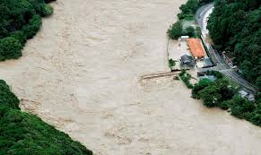 Heavy rain floods southern Japan, leaving over dozen missing